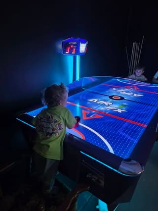 Family enjoying food and time together in Billie-Jo's game room